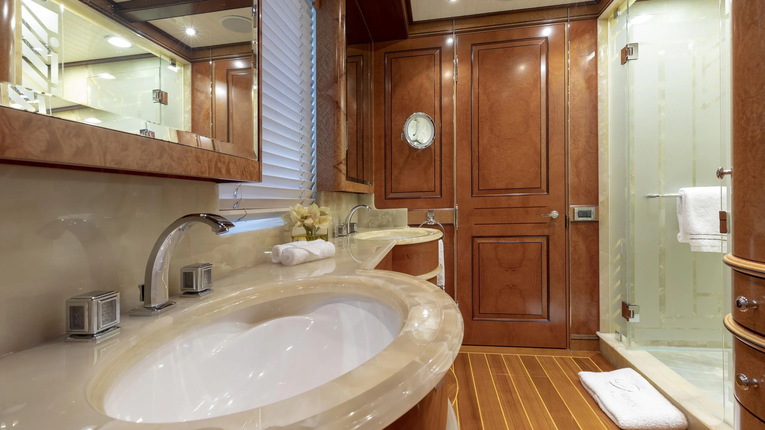 a bathroom with a sink and cabinets aboard NADAN Yacht for Sale