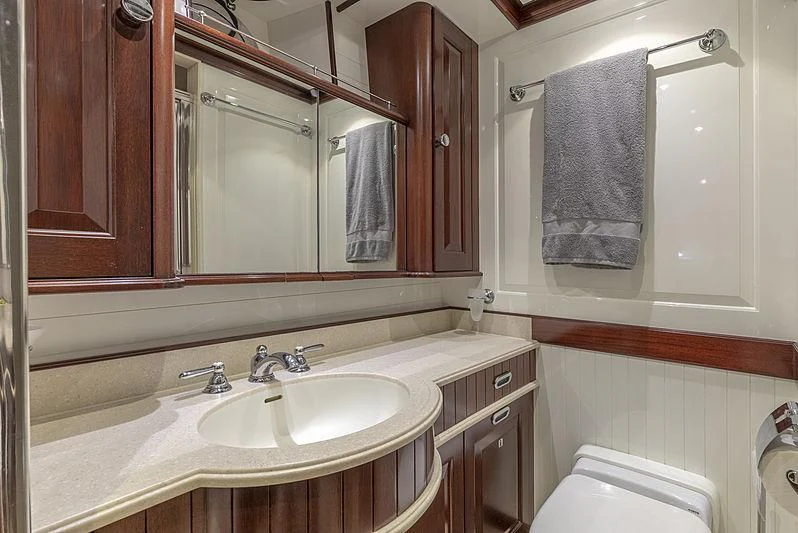 a bathroom with a sink and a mirror aboard NADAN Yacht for Sale