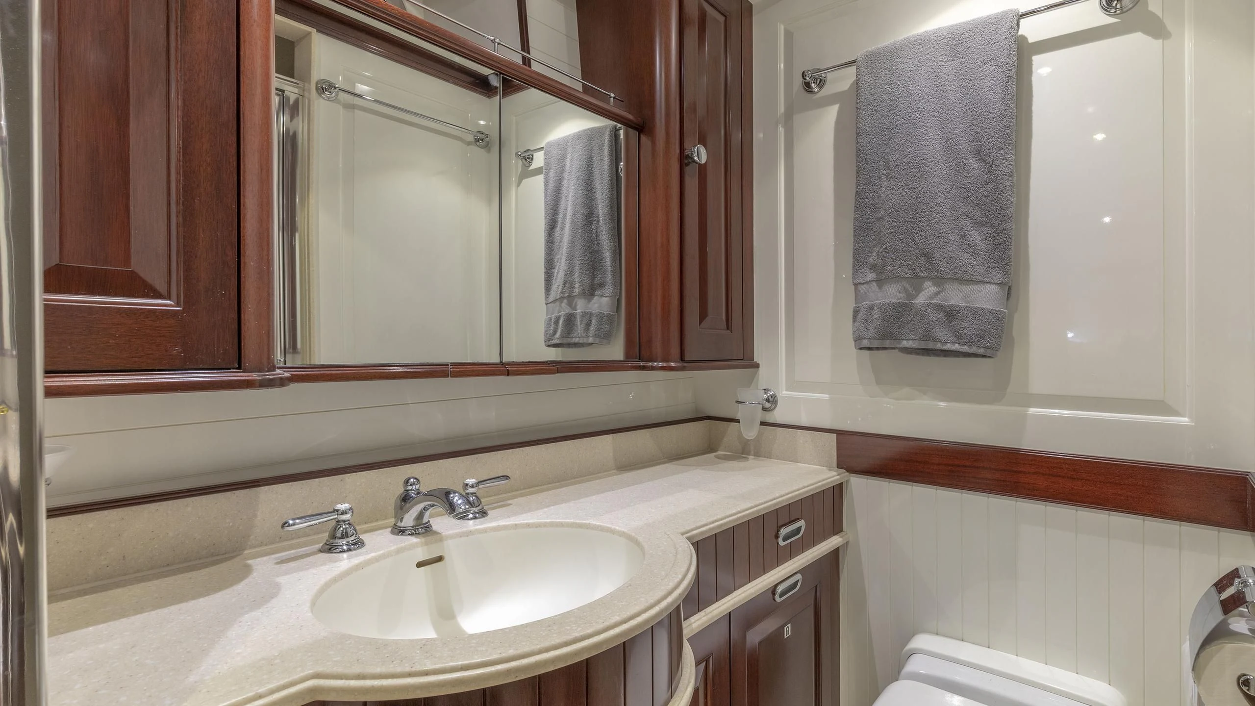 a bathroom with a sink and a mirror aboard NADAN Yacht for Sale