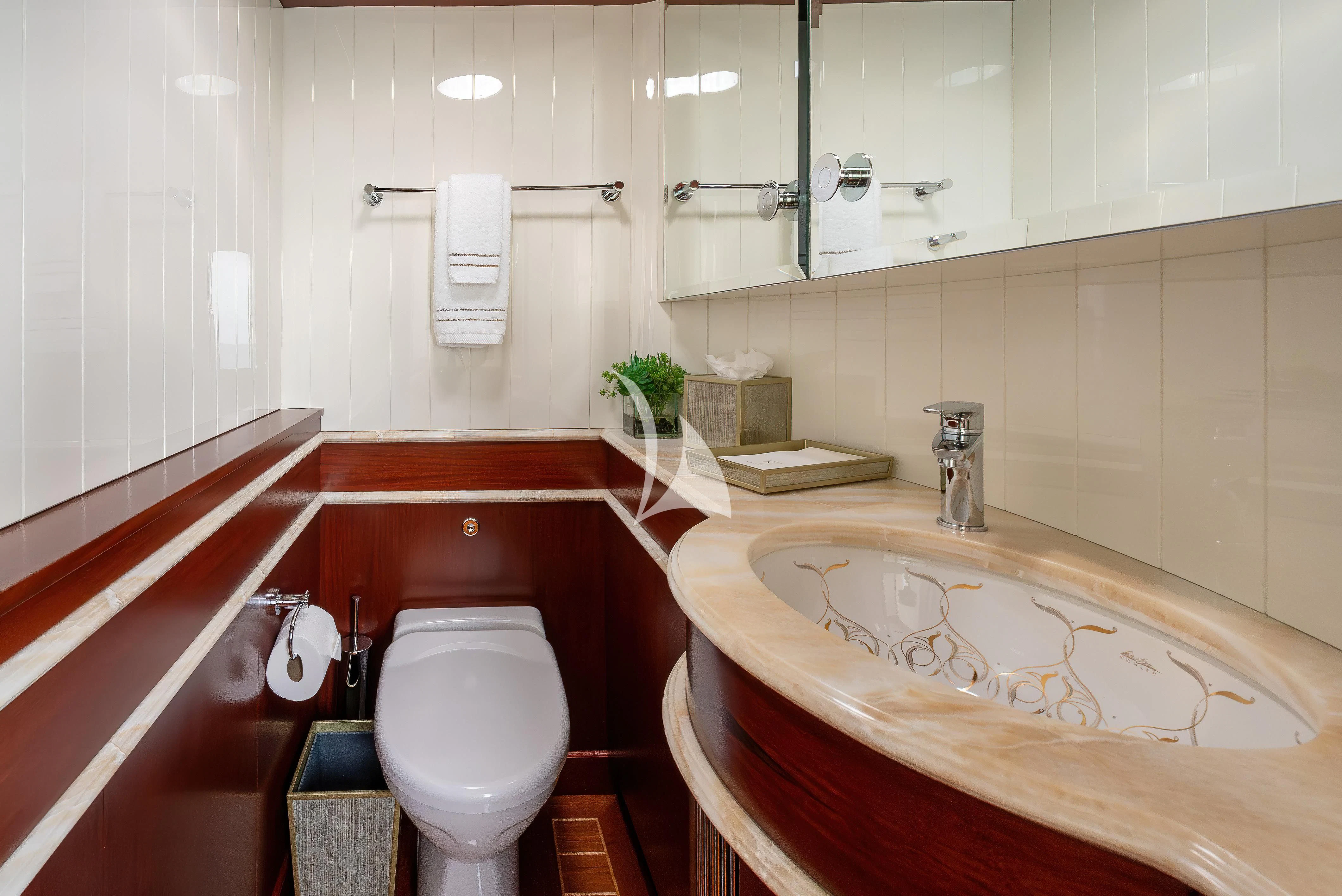a bathroom with a sink and toilet aboard NADAN Yacht for Sale