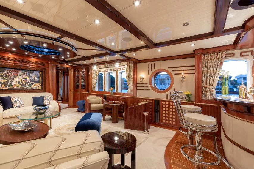 a living room with a large mirror aboard NADAN Yacht for Sale