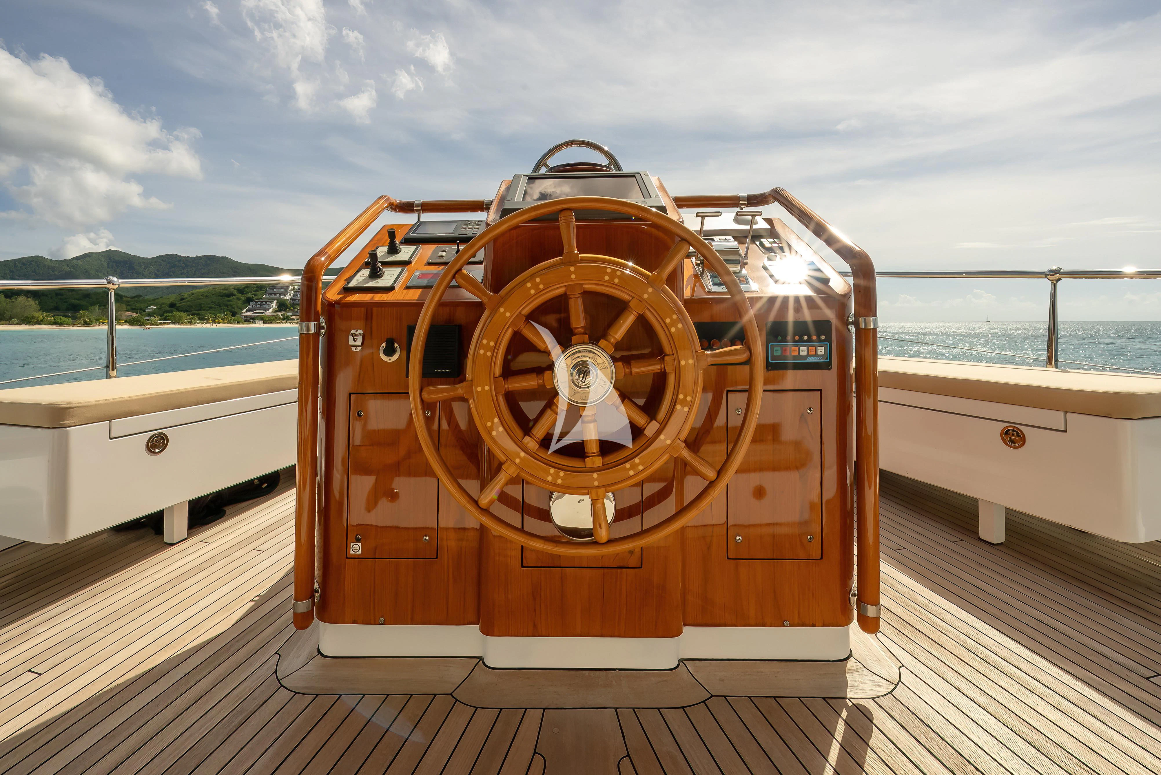 a large orange boat on a dock aboard NADAN Yacht for Sale