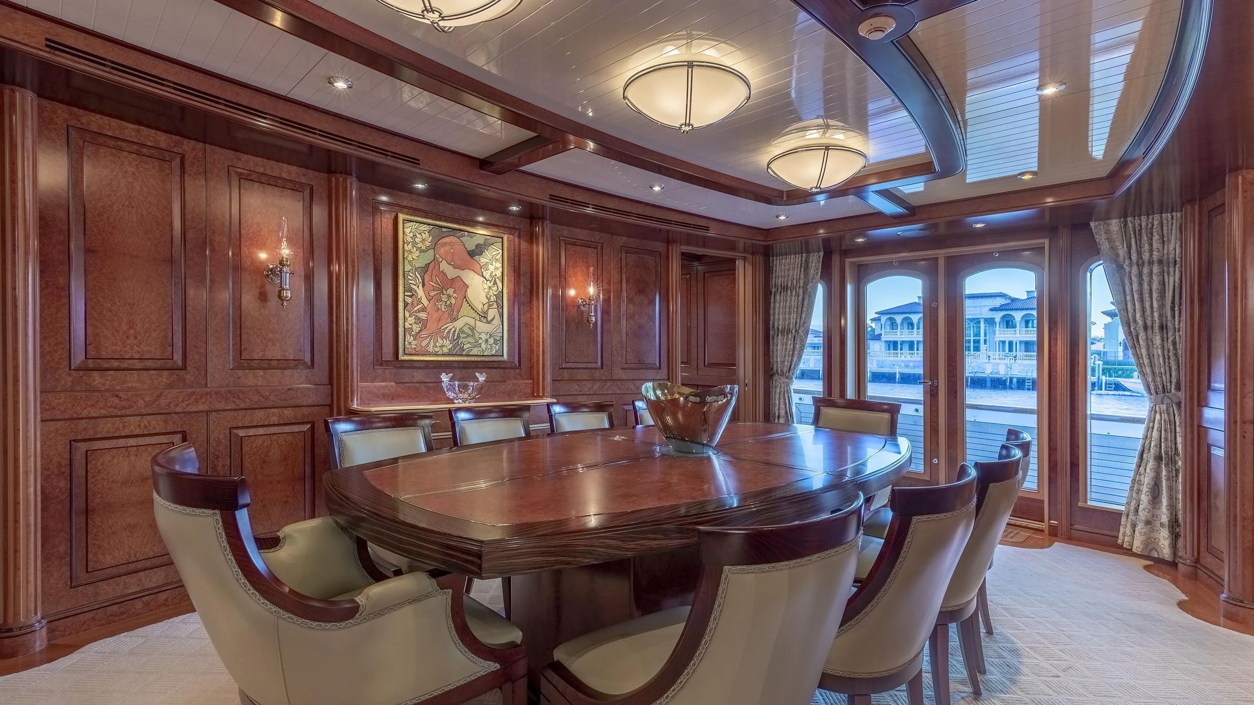 a large dining room with a large table and chairs aboard NADAN Yacht for Sale