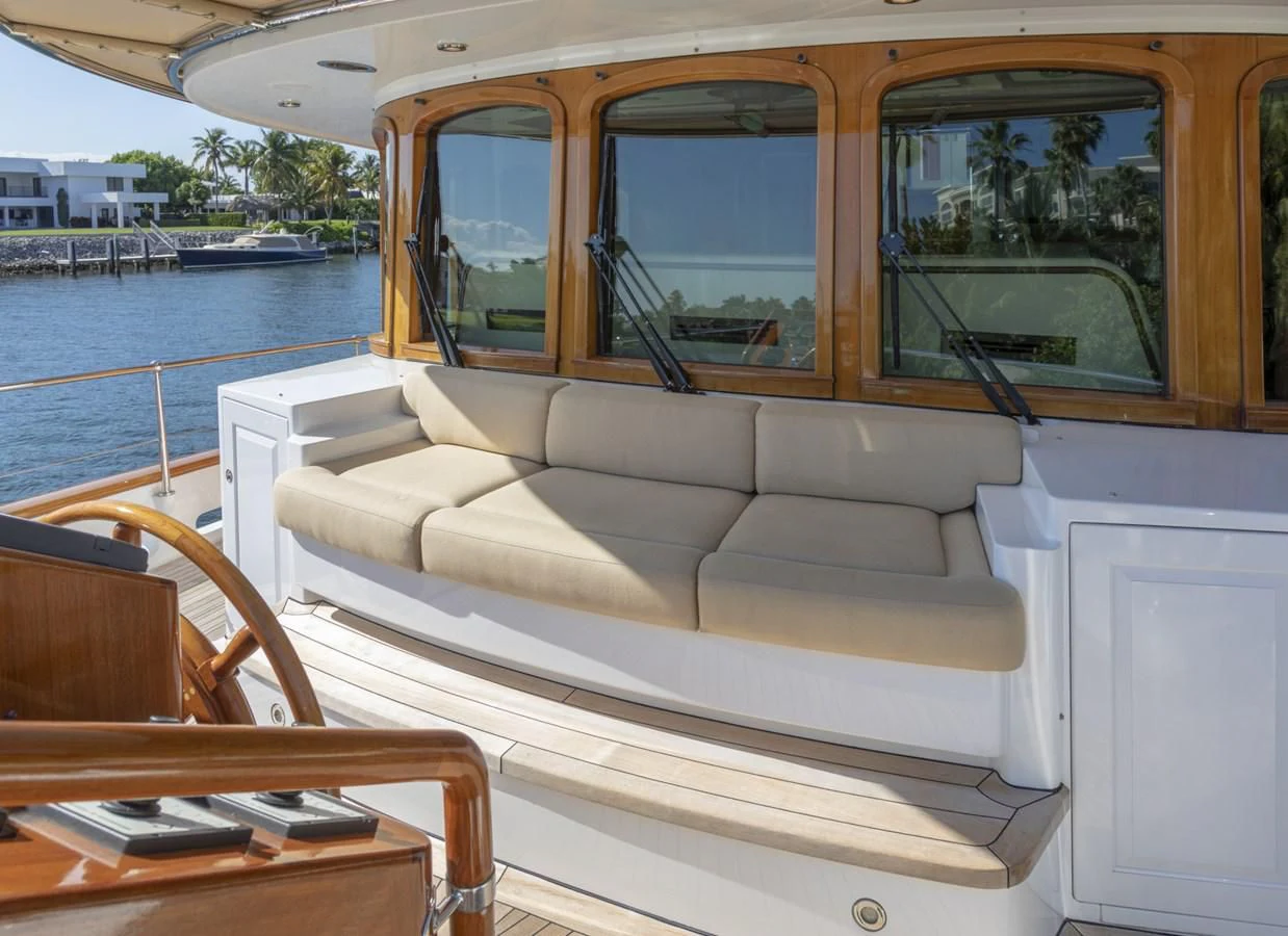a boat with a couch and a table on it aboard NADAN Yacht for Sale