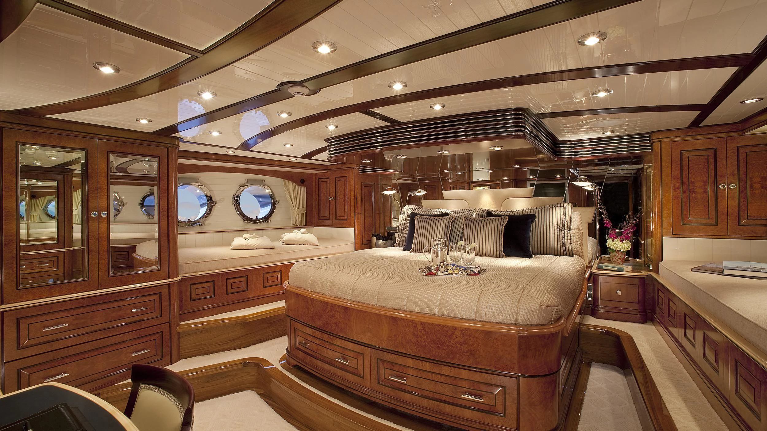 a large living room with wooden furniture aboard NADAN Yacht for Sale