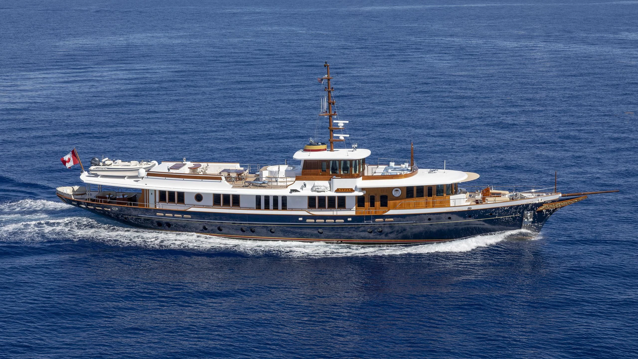 a large ship in the water aboard NADAN Yacht for Sale