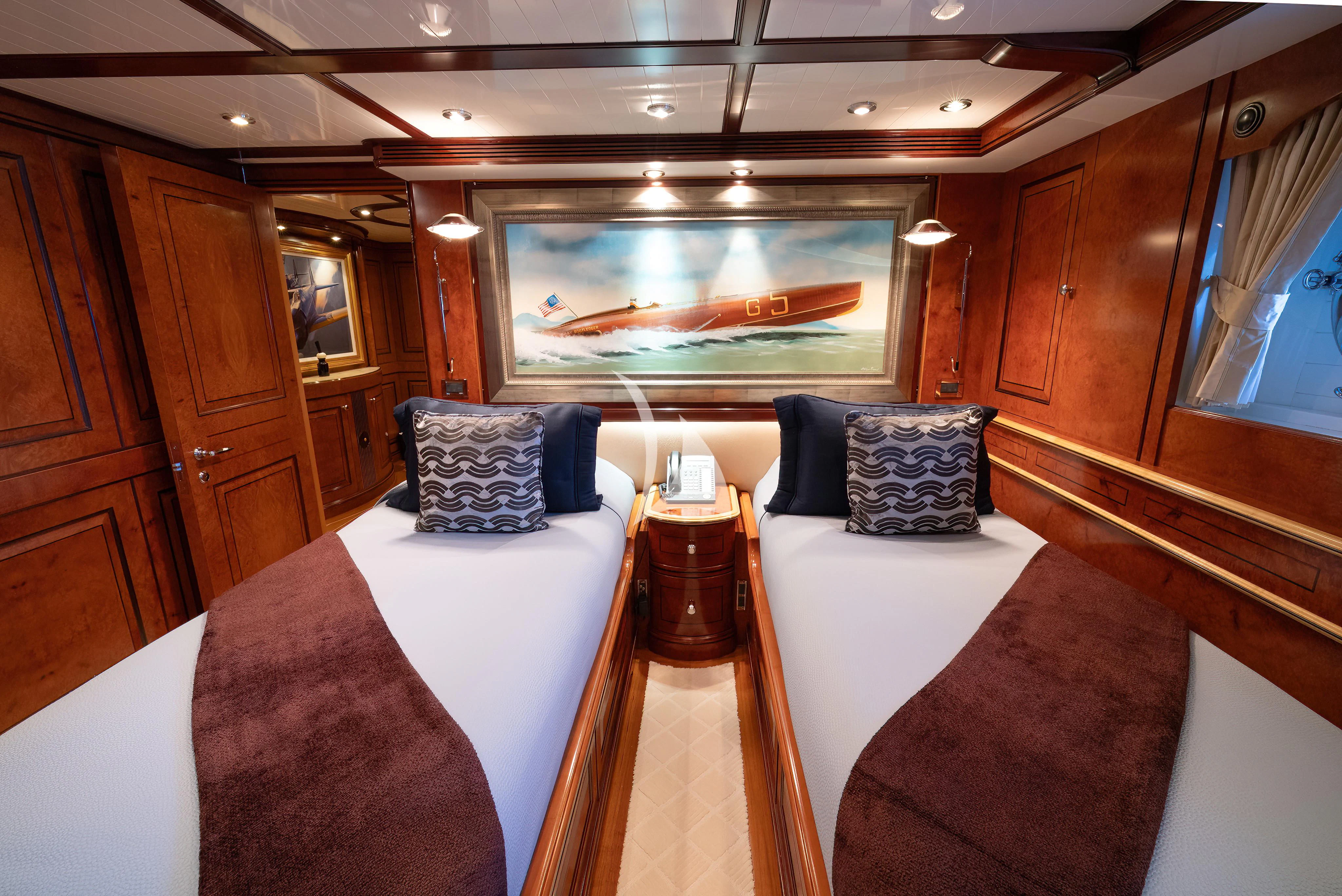 a room with a bed and a television aboard NADAN Yacht for Sale