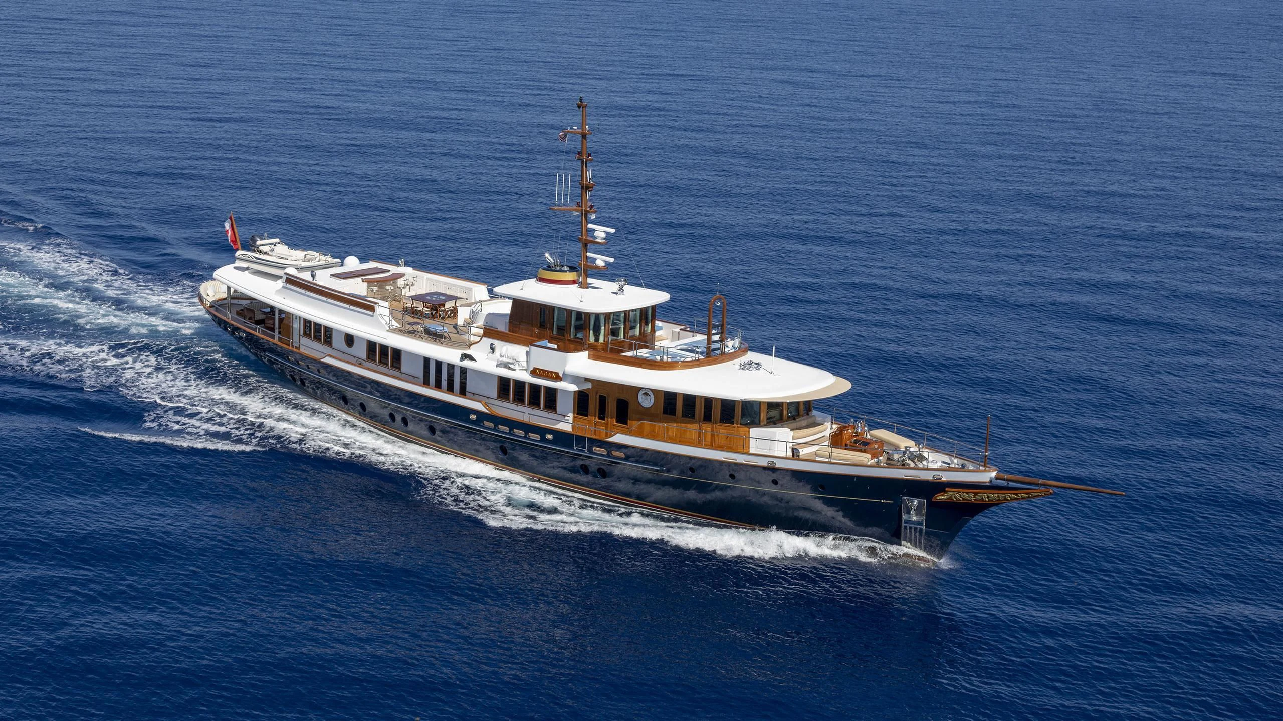 a large ship in the water aboard NADAN Yacht for Sale