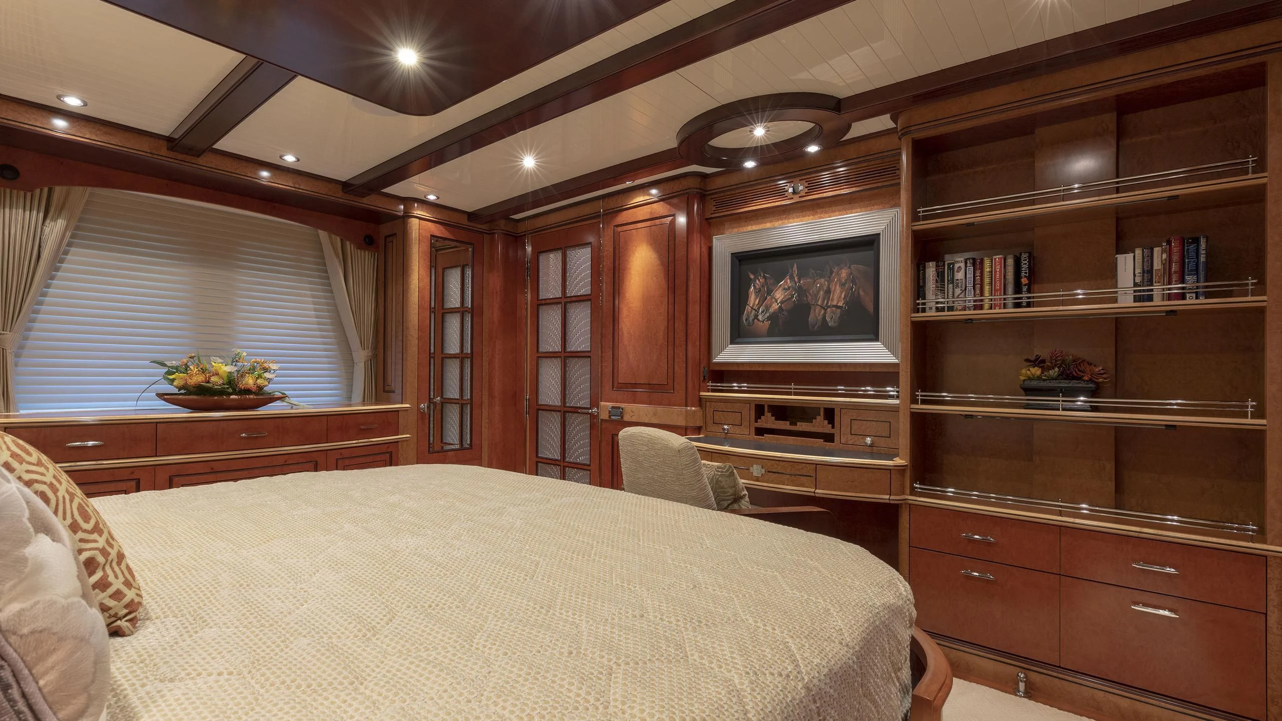 a bedroom with a bed and a television aboard NADAN Yacht for Sale