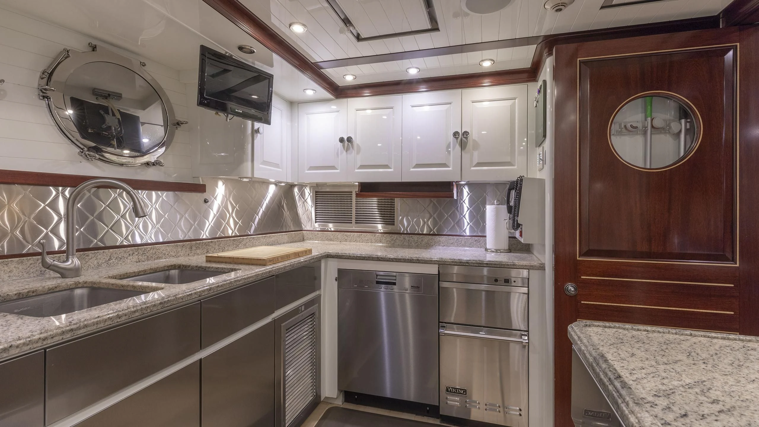 a kitchen with a large sink and a microwave aboard NADAN Yacht for Sale