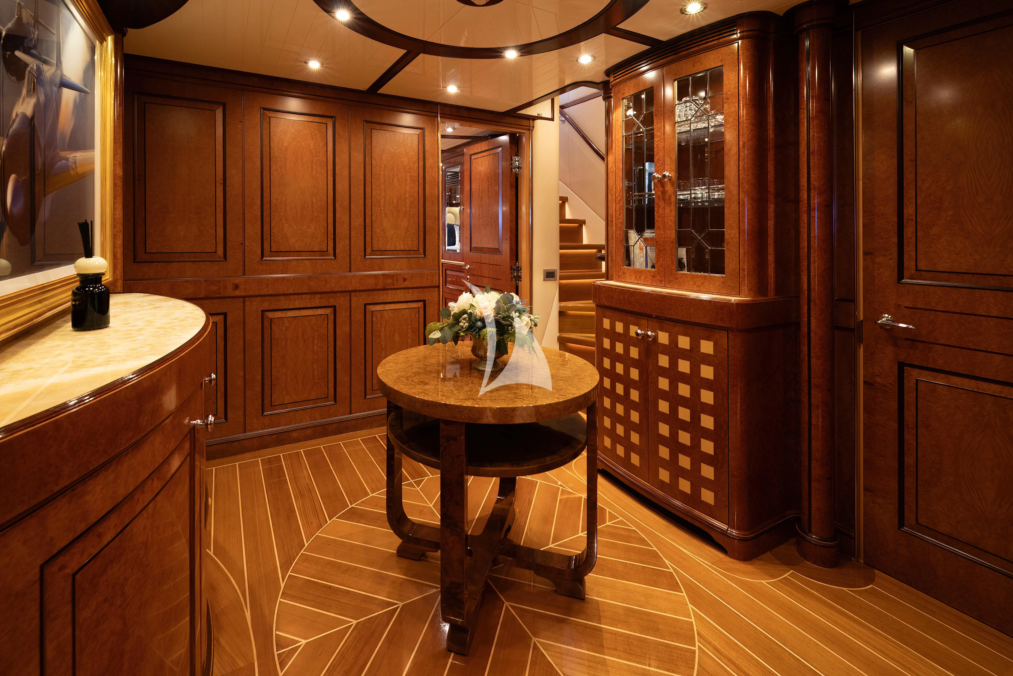 a kitchen with wooden cabinets aboard NADAN Yacht for Sale