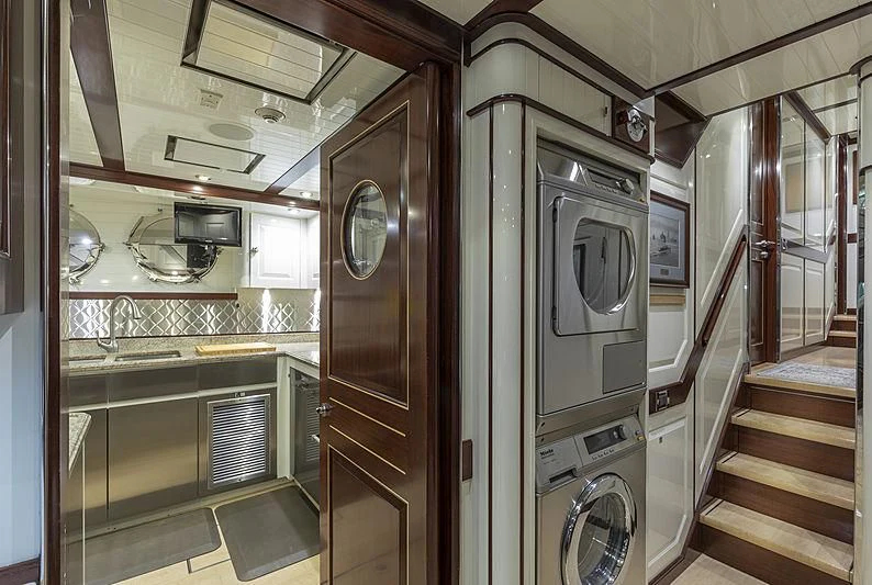 a kitchen with a stove and oven aboard NADAN Yacht for Sale