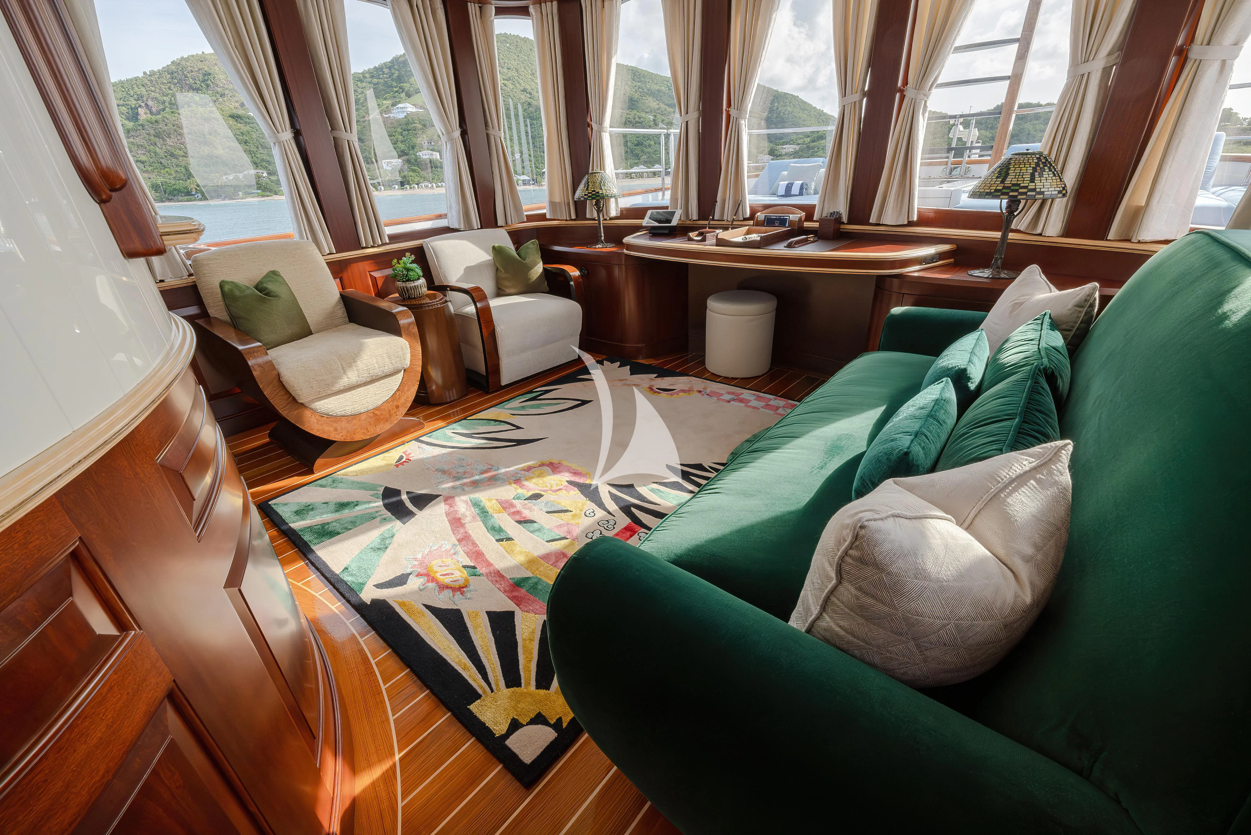a living room with a couch and a coffee table aboard NADAN Yacht for Sale