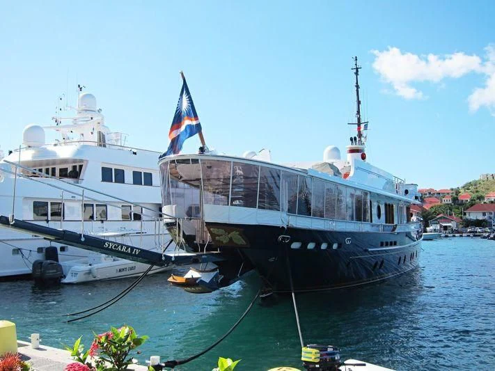 a couple of boats on the water aboard NADAN Yacht for Sale