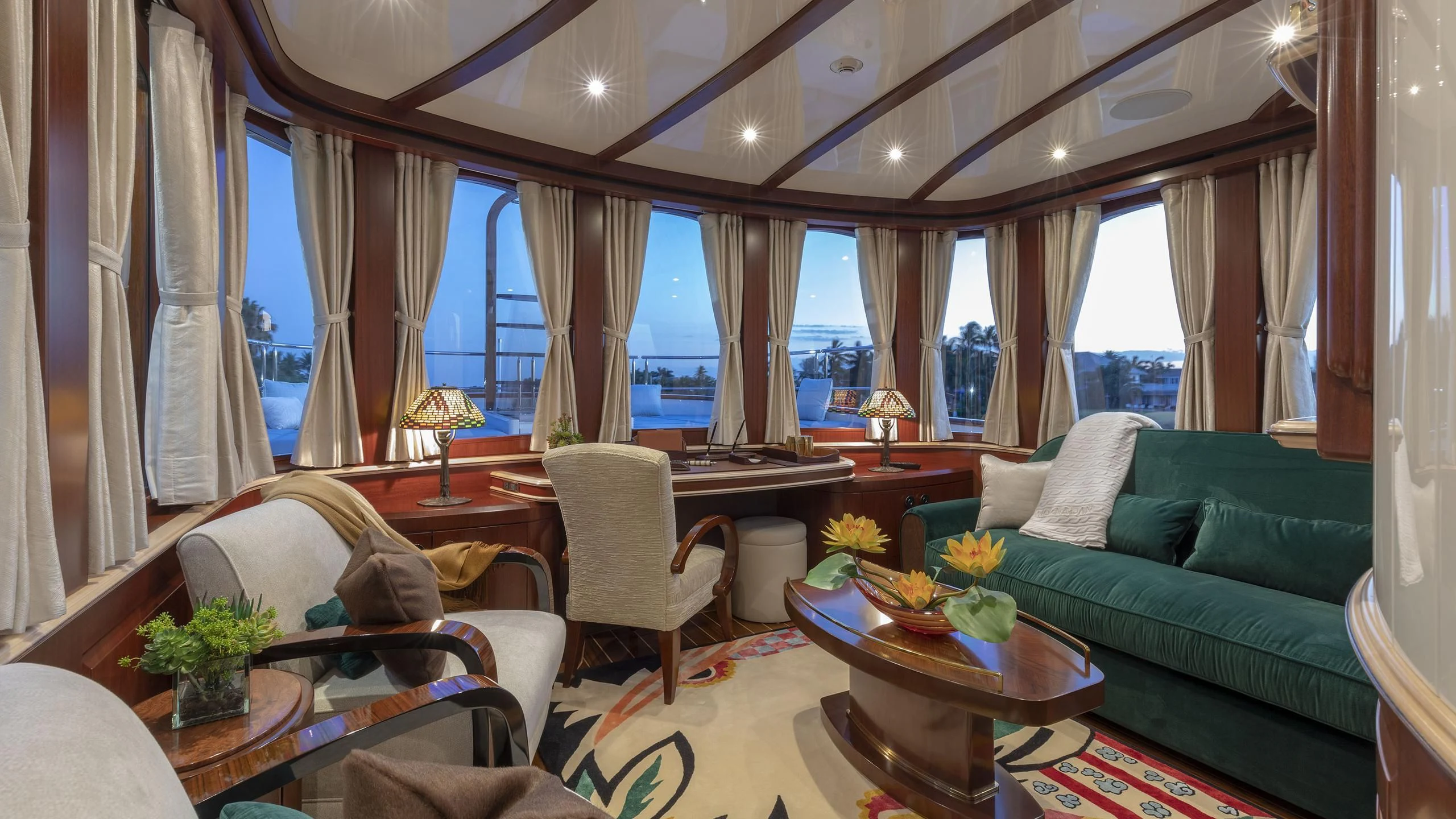 a living room with a couch and a table aboard NADAN Yacht for Sale