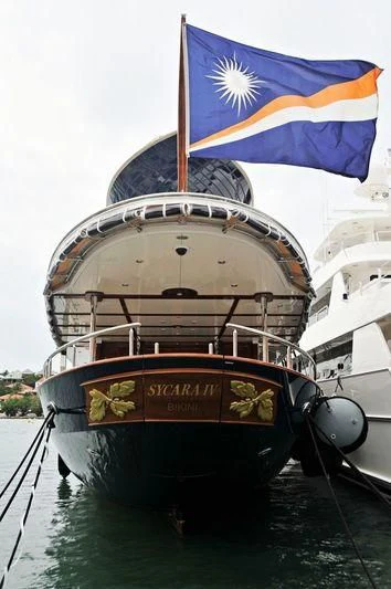 a boat with a flag on it aboard NADAN Yacht for Sale