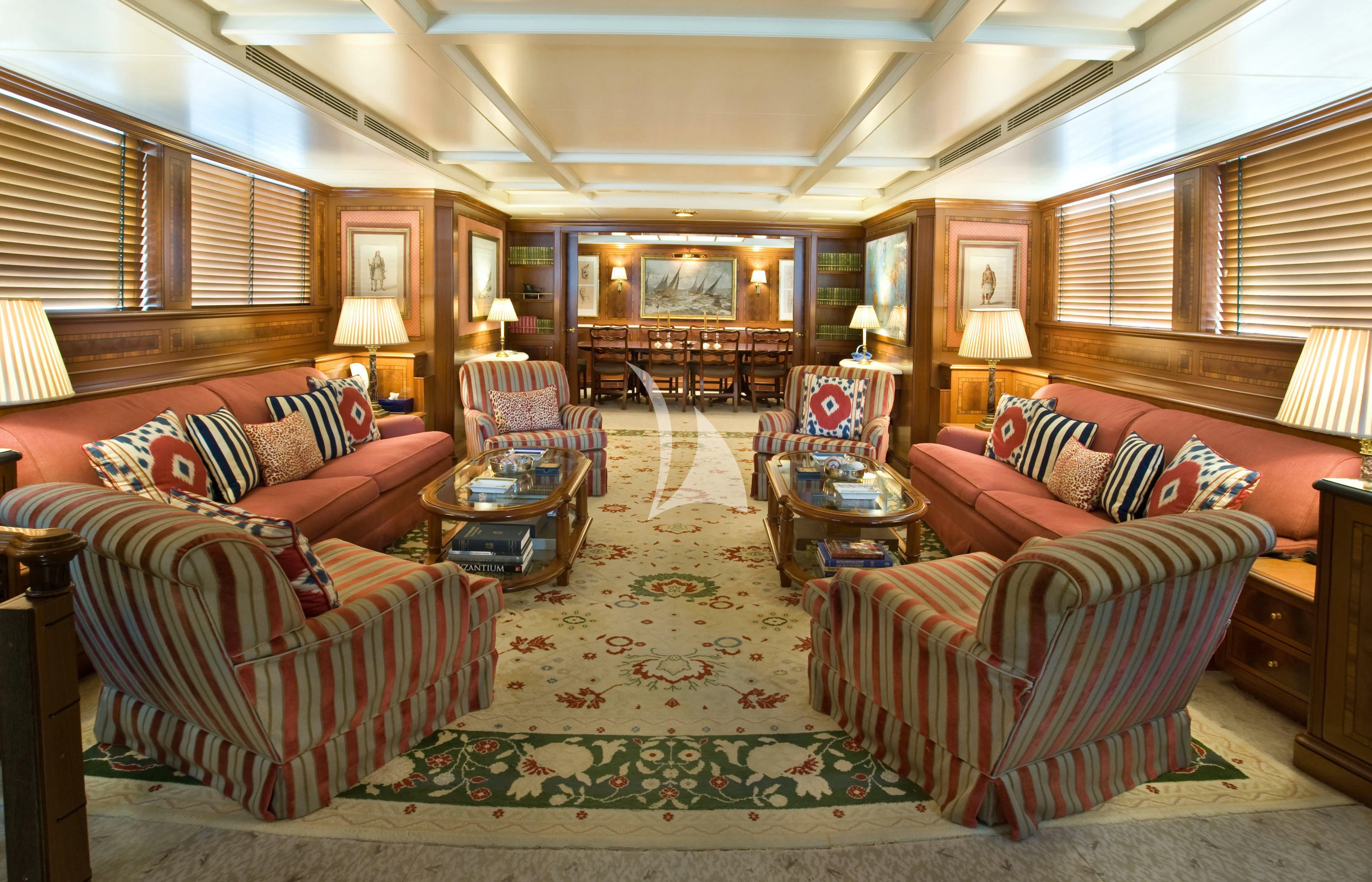 a living room with a large rug aboard OKTANA Yacht for Sale