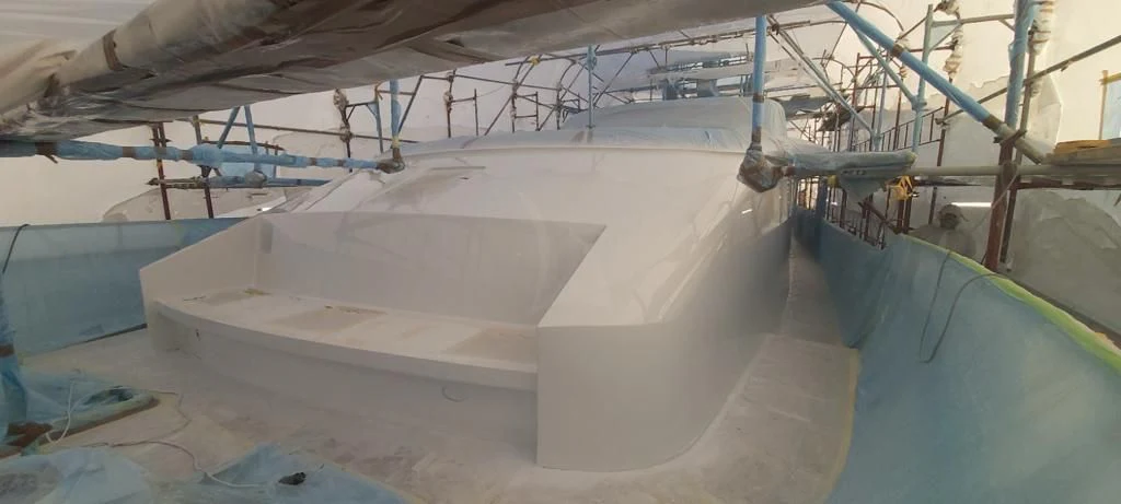 a large white boat in a large room aboard OKTANA Yacht for Sale