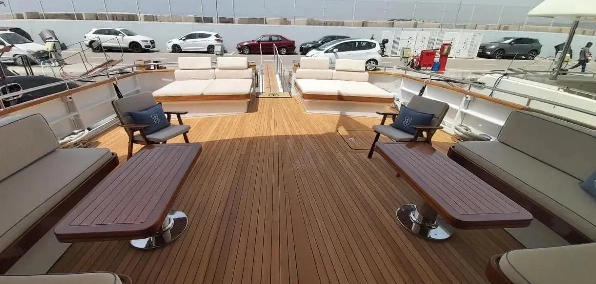 a room with a table and chairs aboard OKTANA Yacht for Sale