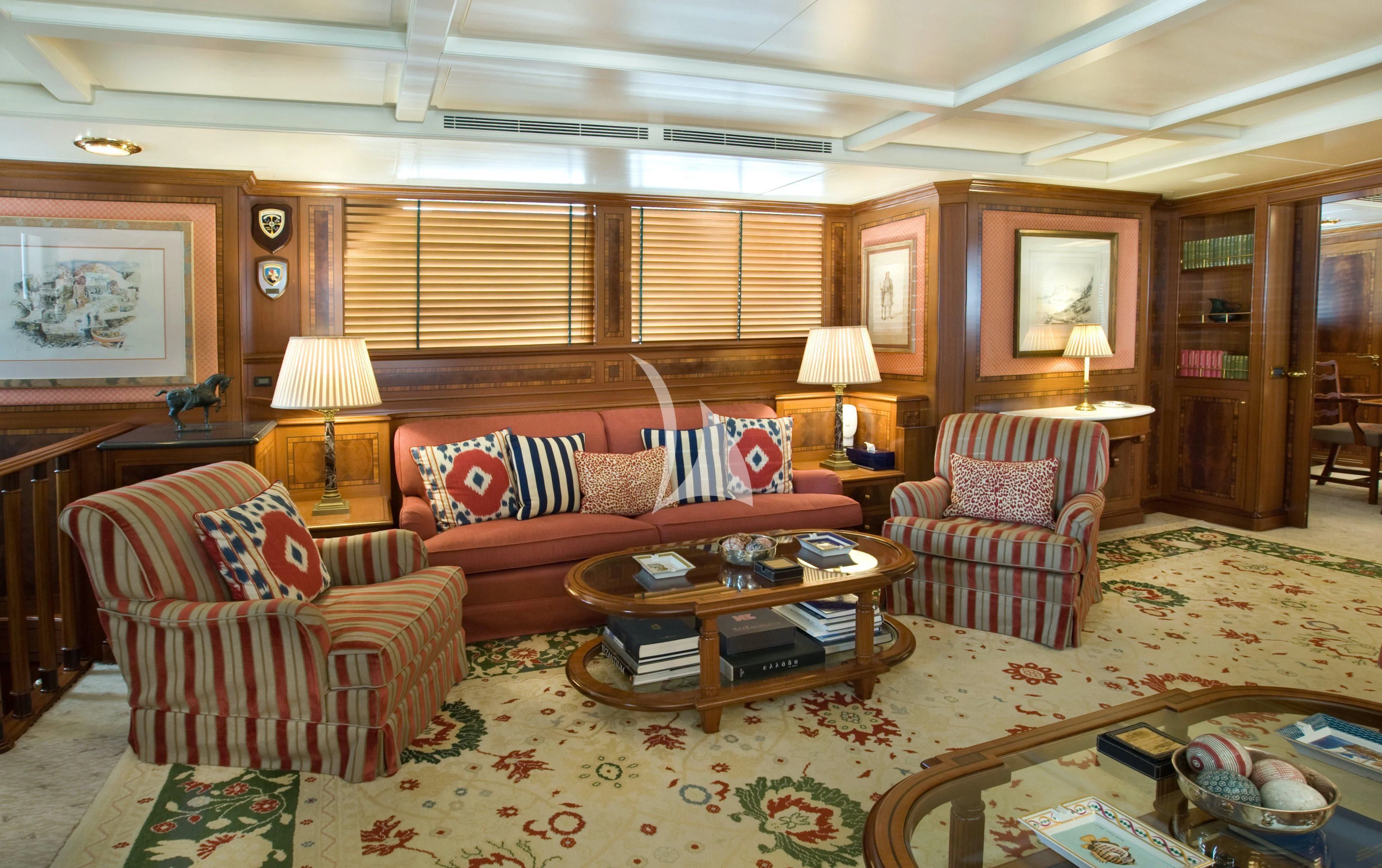 a living room with a couch and a coffee table aboard OKTANA Yacht for Sale
