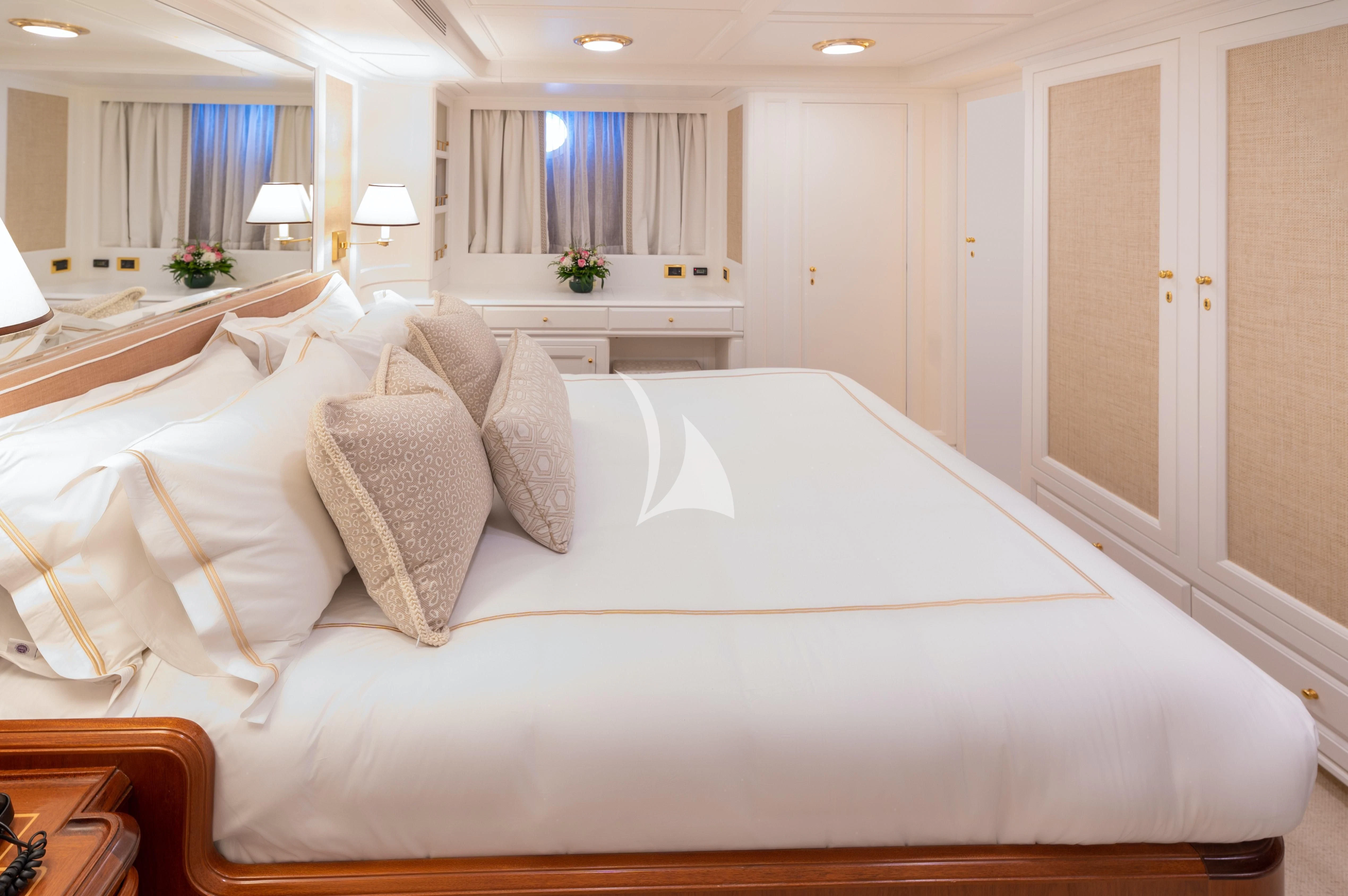 a large bed in a hotel room aboard OKTANA Yacht for Sale