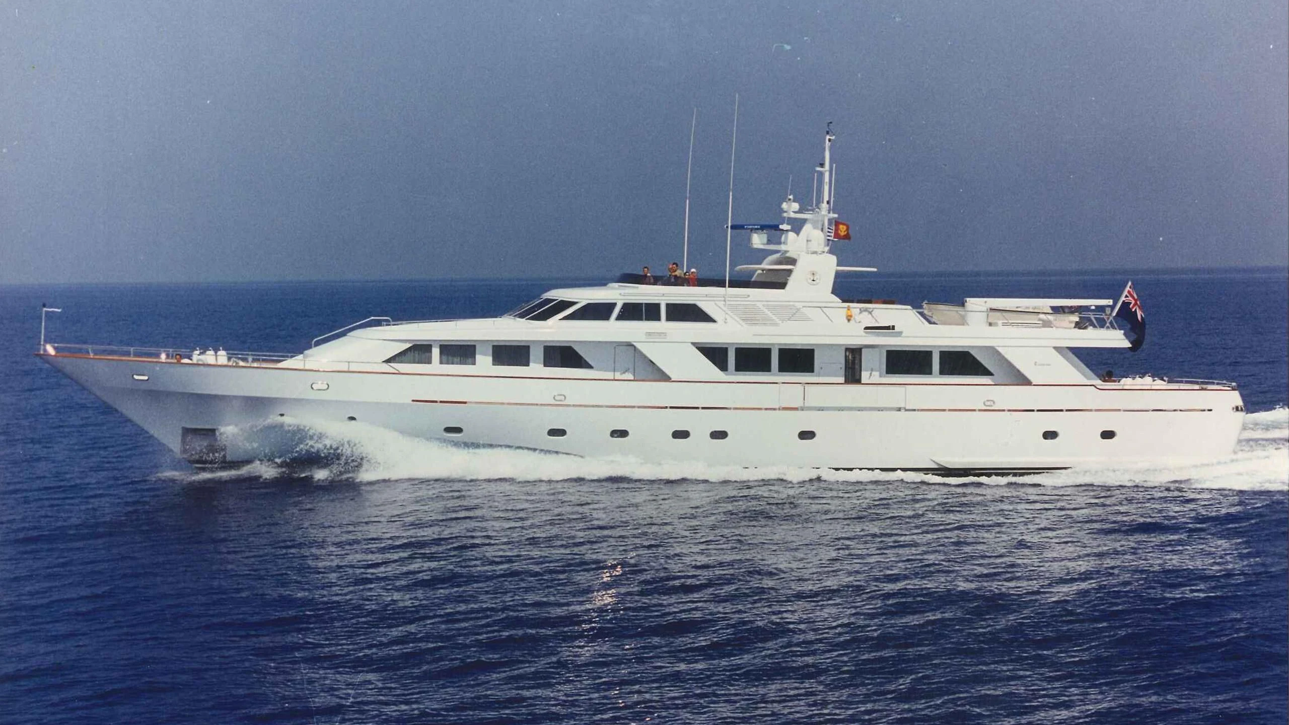 a white yacht in the water aboard OKTANA Yacht for Sale