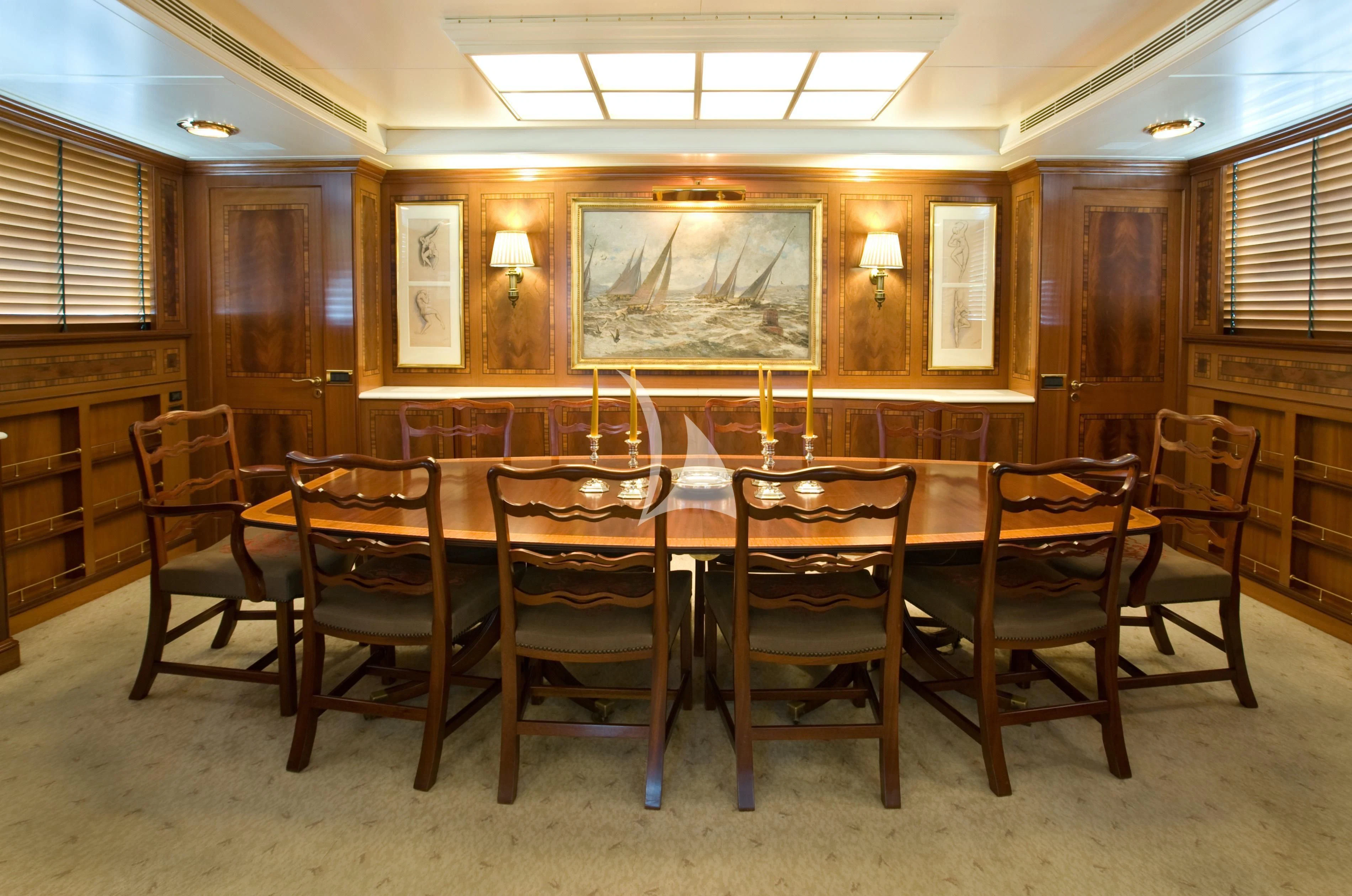 a dining table in a house aboard OKTANA Yacht for Sale