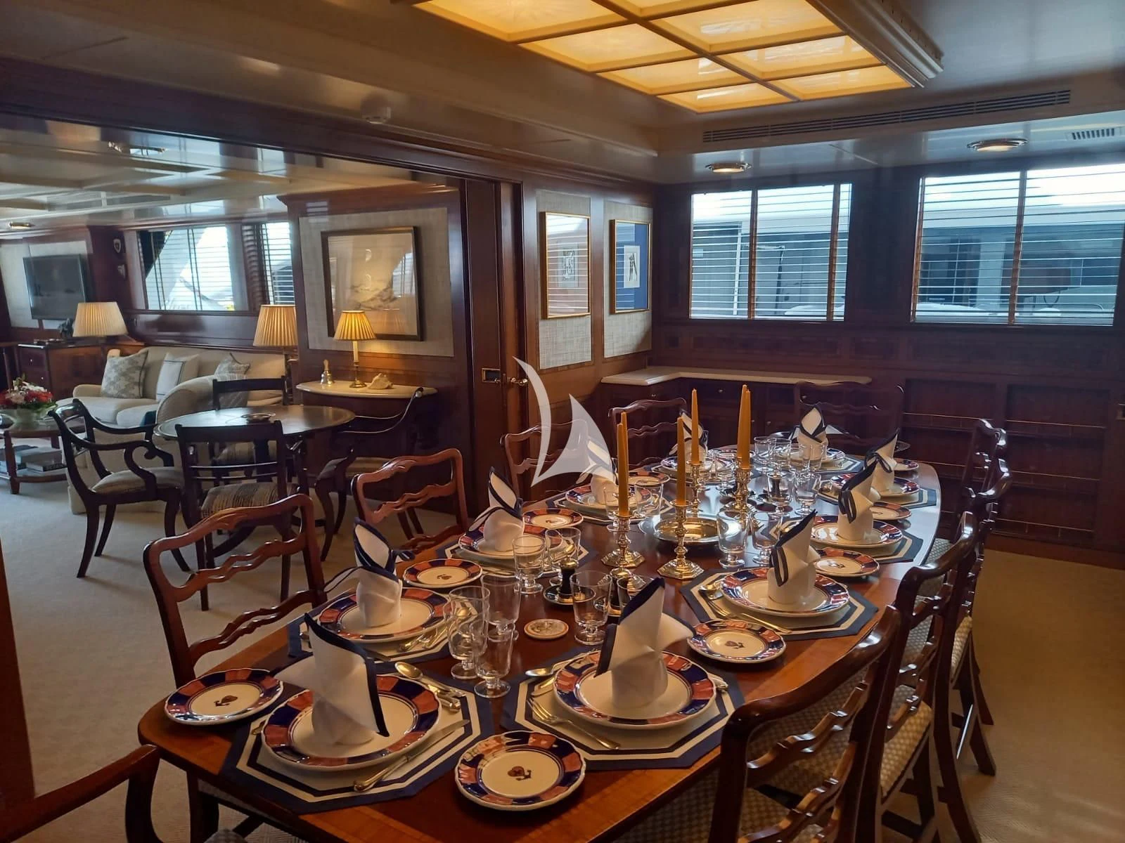 a large dining room with tables and chairs aboard OKTANA Yacht for Sale