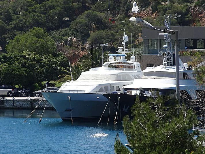 a group of boats are parked in a harbor aboard OKTANA Yacht for Sale