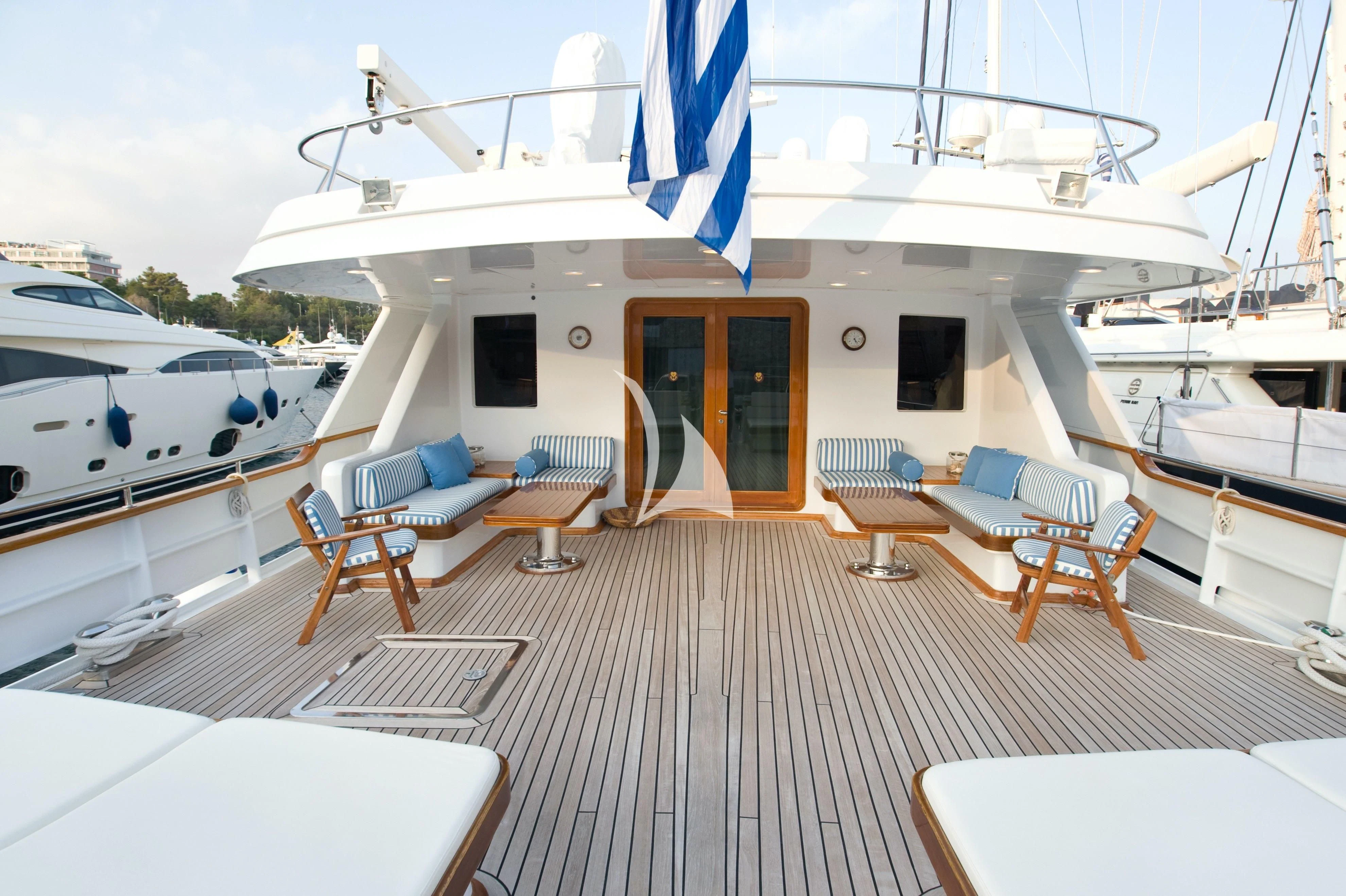 a boat docked at a pier aboard OKTANA Yacht for Sale