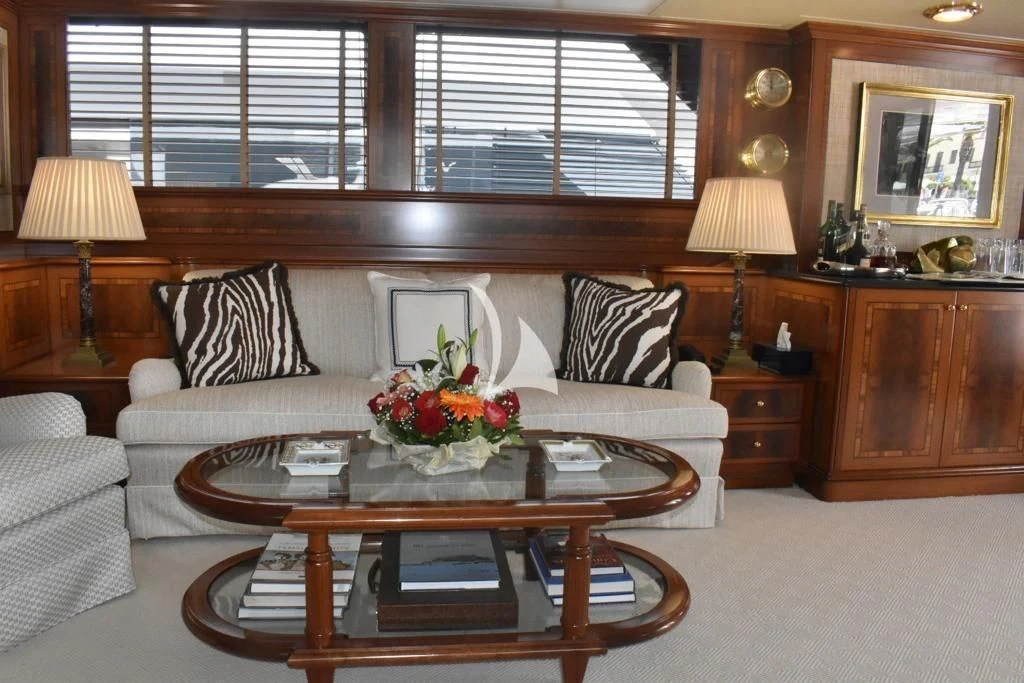 a living room with a white couch aboard OKTANA Yacht for Sale