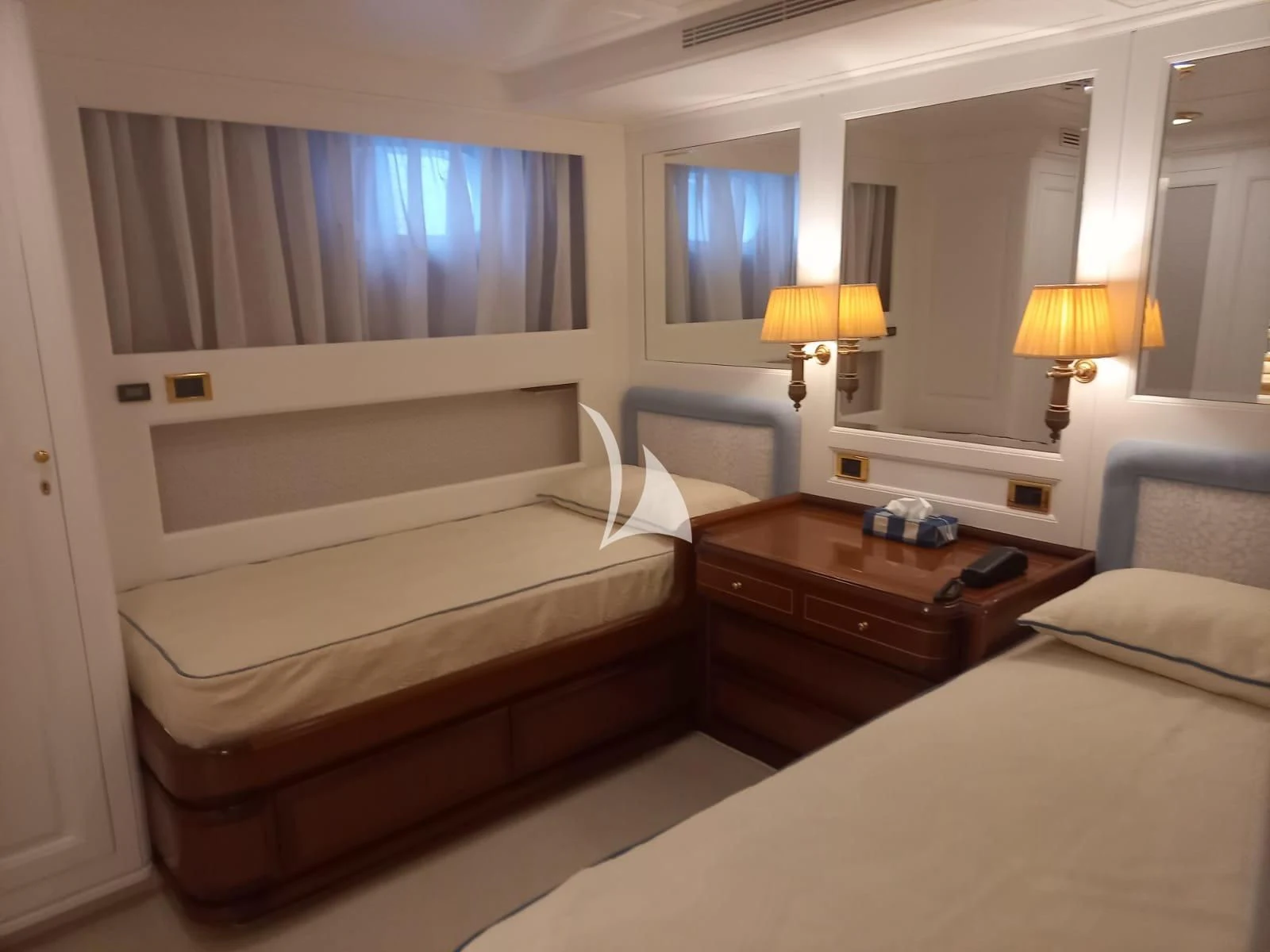 a room with two beds aboard OKTANA Yacht for Sale