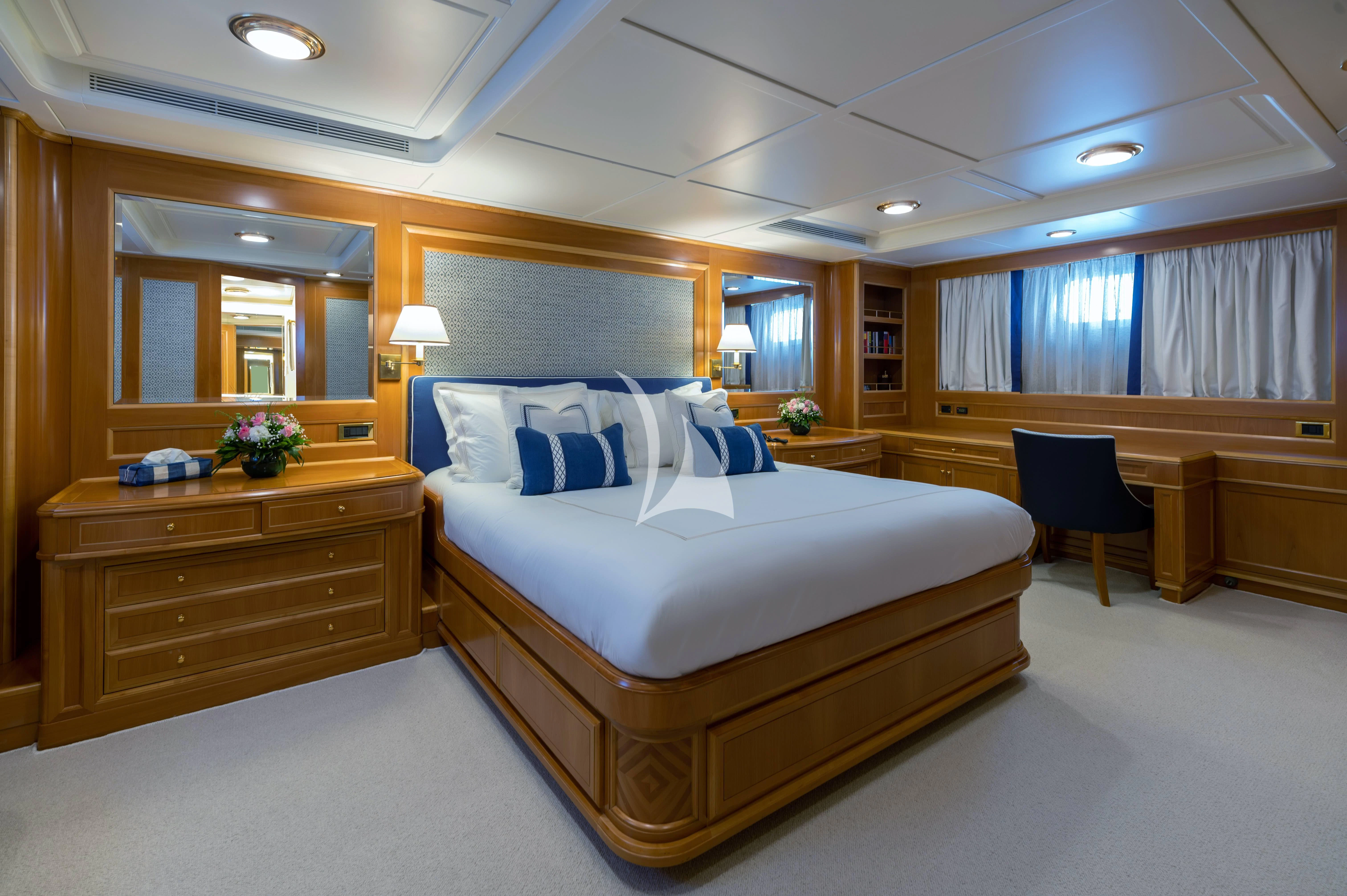 a large bedroom with a large bed aboard OKTANA Yacht for Sale