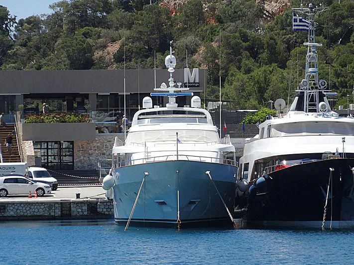 a few boats are parked in the water aboard OKTANA Yacht for Sale
