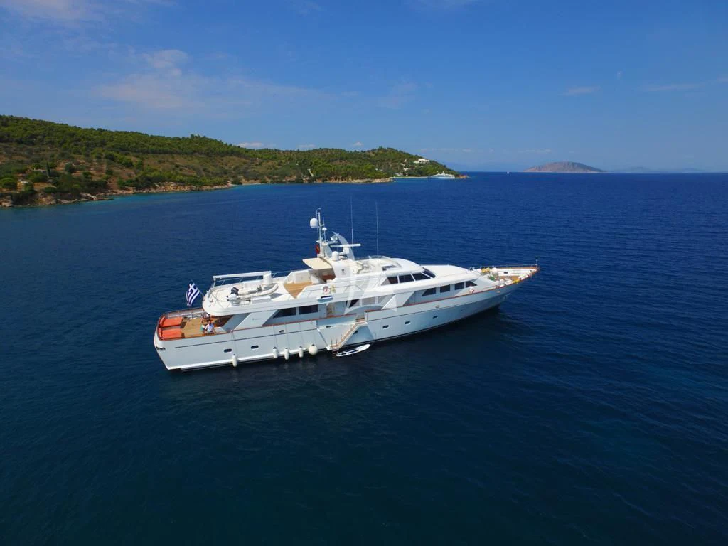 a white boat in the water aboard OKTANA Yacht for Sale
