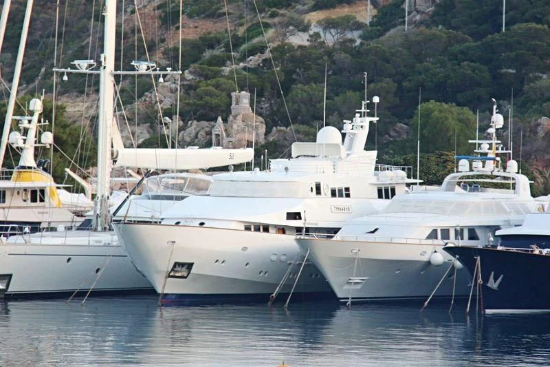 a group of boats in a harbor aboard OKTANA Yacht for Sale