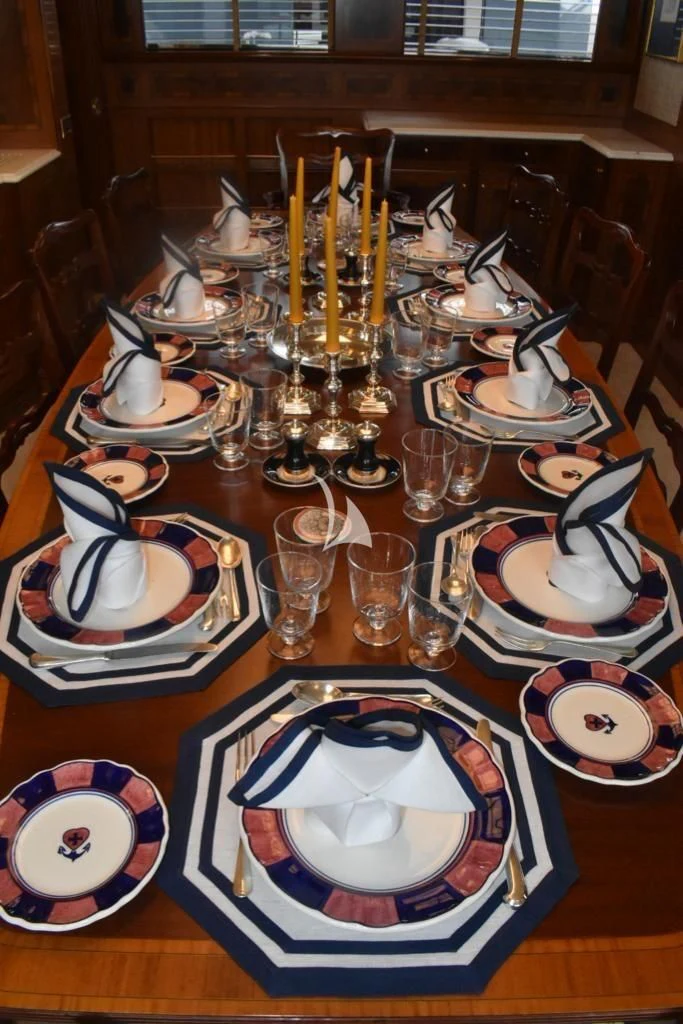 a table with plates and glasses aboard OKTANA Yacht for Sale