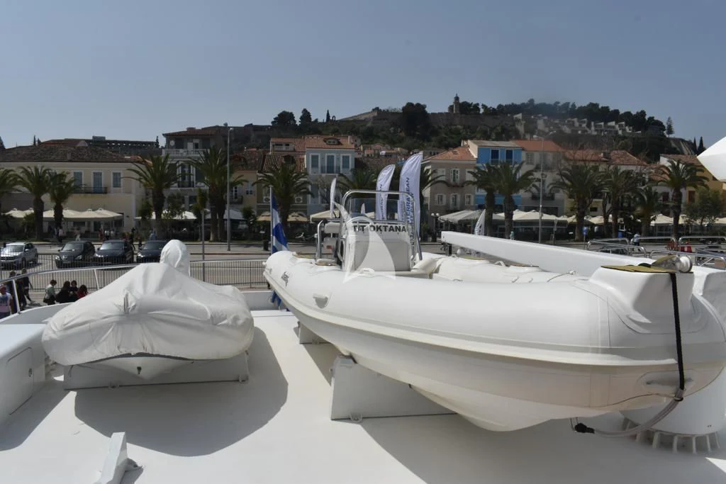 a couple of white boats on a beach aboard OKTANA Yacht for Sale
