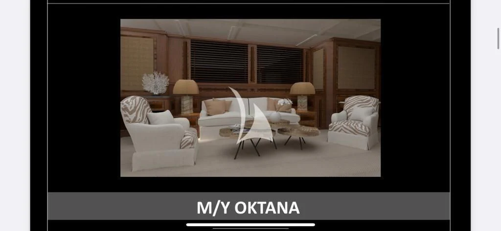 a room with a bed and a chair aboard OKTANA Yacht for Sale