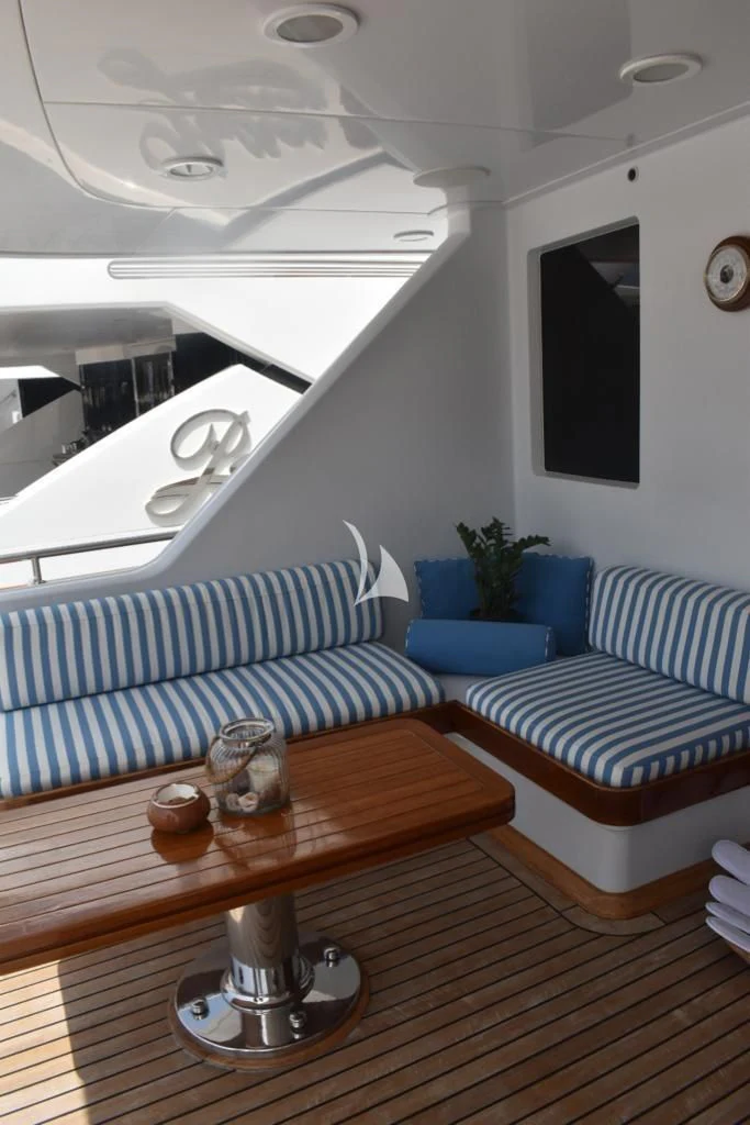 a living room with a couch and a coffee table aboard OKTANA Yacht for Sale