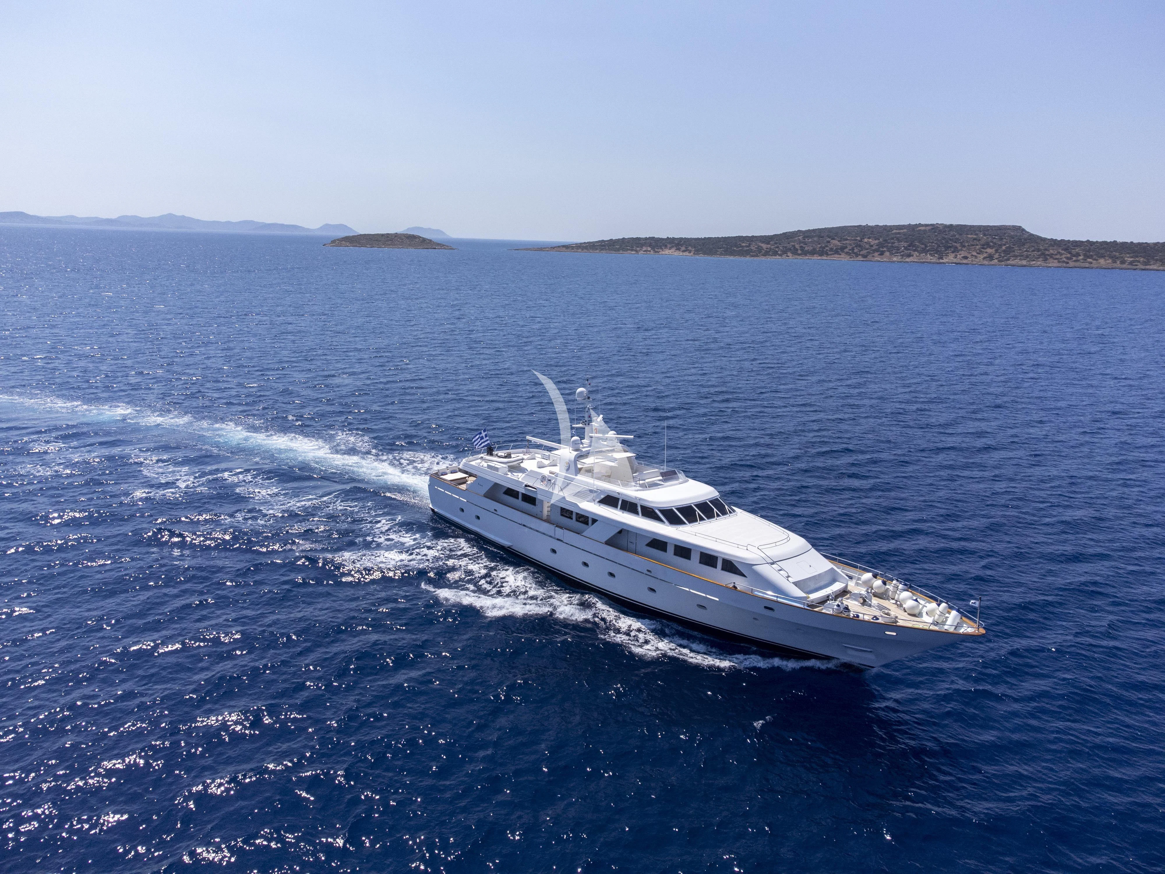 a white yacht in the water aboard OKTANA Yacht for Sale