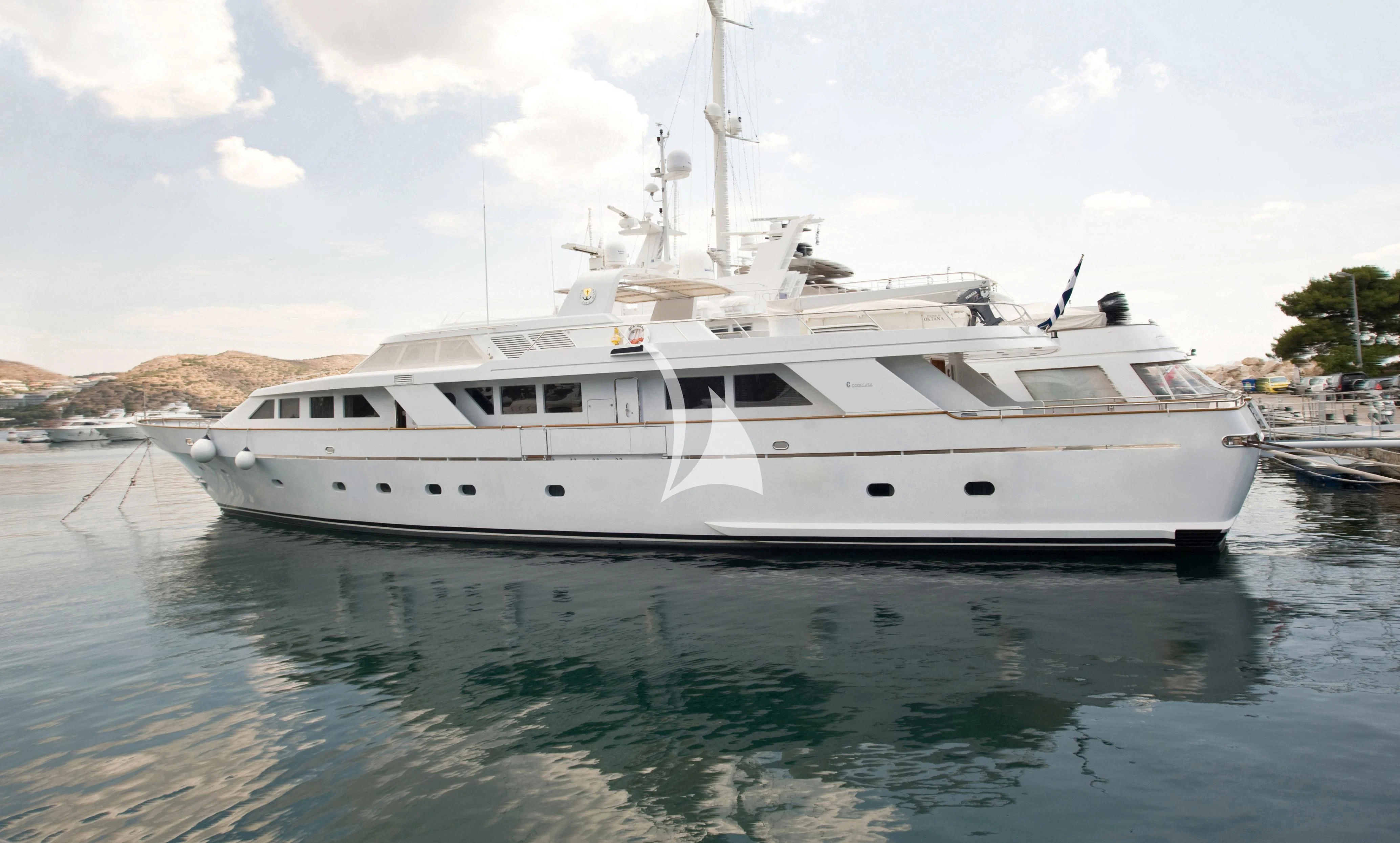 a white yacht in the water aboard OKTANA Yacht for Sale