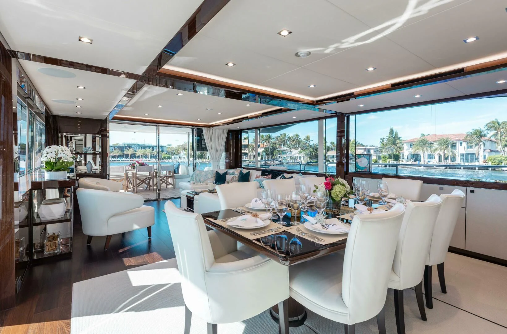 a dining room with a large window aboard MIRRACLE Yacht for Sale