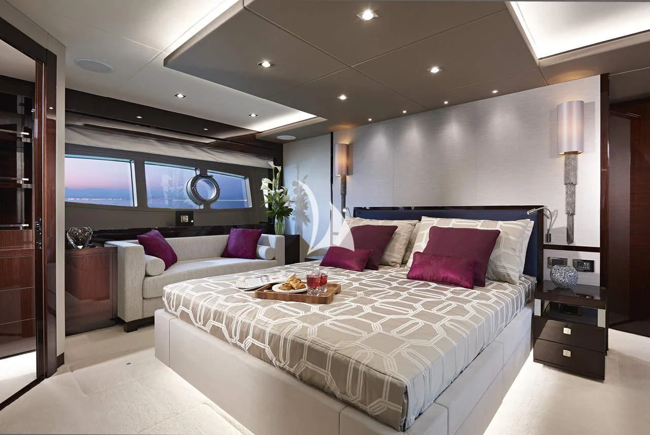 a large bed in a room aboard MIRRACLE Yacht for Sale