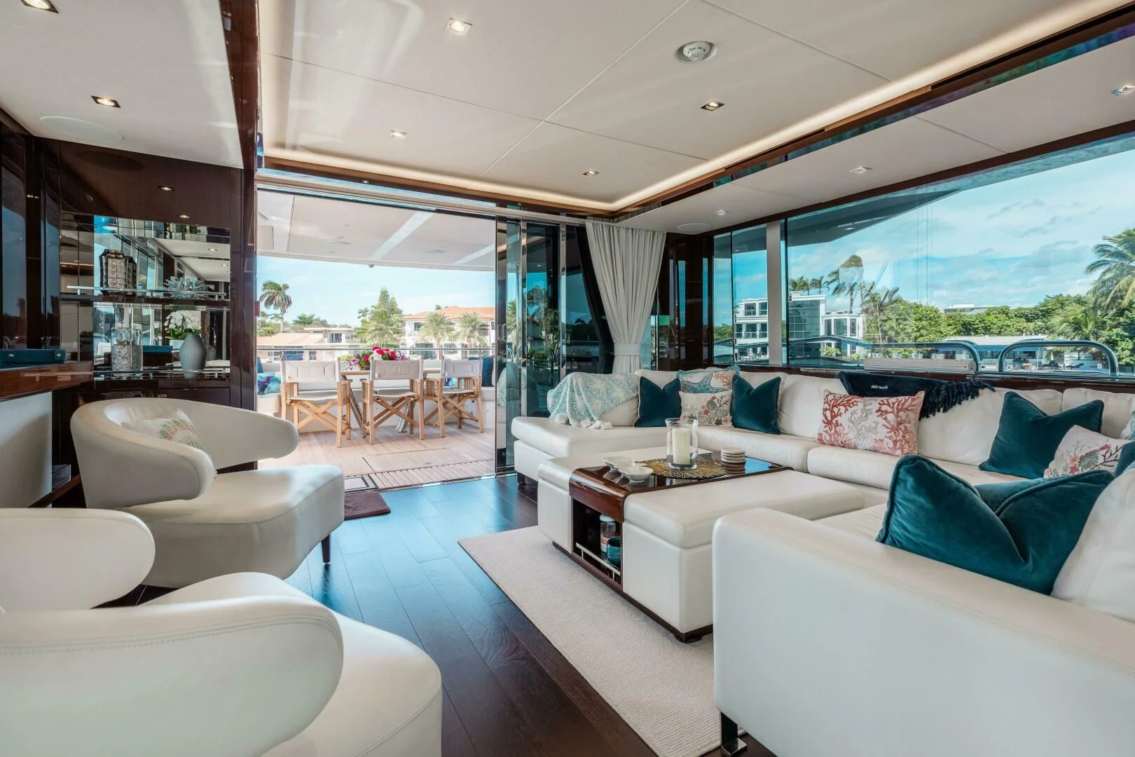 a living room with a large window aboard MIRRACLE Yacht for Sale