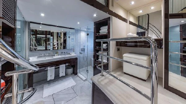 a bathroom with a large mirror aboard MIRRACLE Yacht for Sale