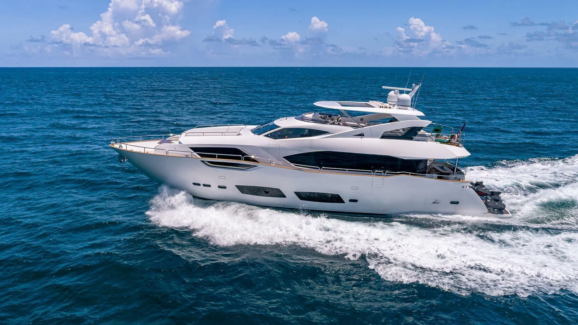 a white yacht on the water aboard MIRRACLE Yacht for Sale