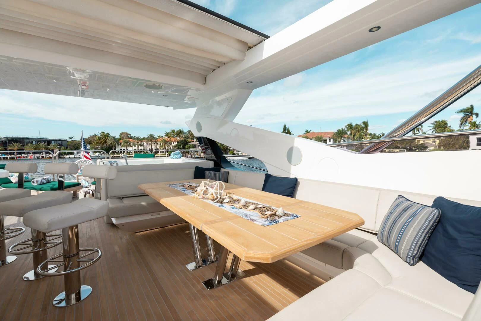 a room with a table and chairs aboard MIRRACLE Yacht for Sale