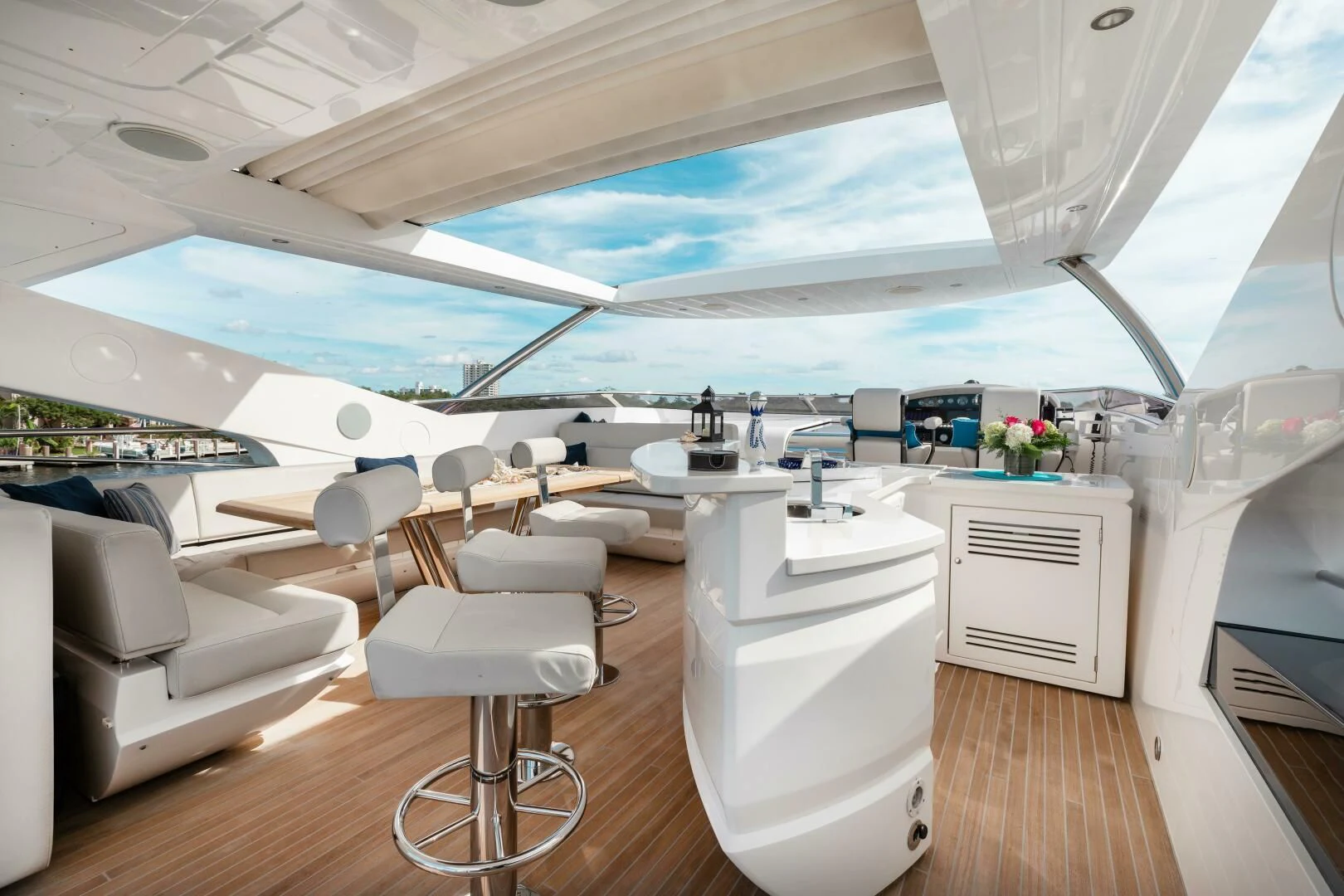 a room with a view of the ocean and the deck aboard MIRRACLE Yacht for Sale