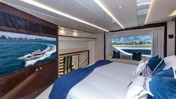 a room with a bed and a pool aboard MIRRACLE Yacht for Sale